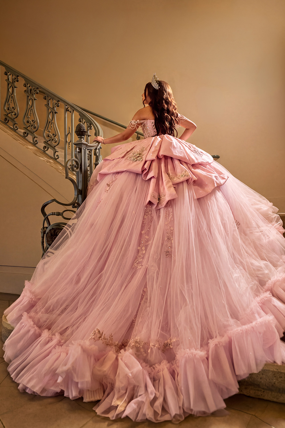 Quinceañera gown detail from behind on a grand staircase